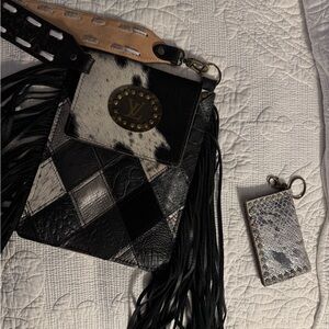 Chic Black and White Crossbody Bag with Fringe